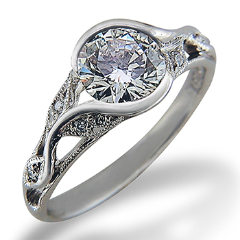 Style:ER403 ~ A delicate leaf pattern envelopes a round brilliant cut diamond.