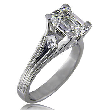 Style:ER405B ~ A touch of an art deco style sets off this emerald cut engagement ring.