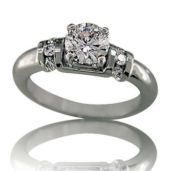 Style:ER417 ~ A round brilliant cut diamond prong set.