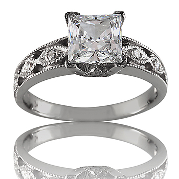 Style:ER421 A prong set princess diamond with bead set round diamonds in a filligree engagement ring.