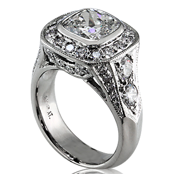 Style: LRM808 ~ A cushion shape diamond set amidst elegance in a platinum engagement ring.