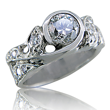 Style:LRR76 ~ A bezel set diamond sits surrounded by leaf shapes.