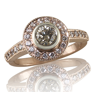 Style: ER427B R748~ Beautiful in Rose Gold", this engagement ring has a round brilliant diamond in a platinum bezel with a halo of diamonds.